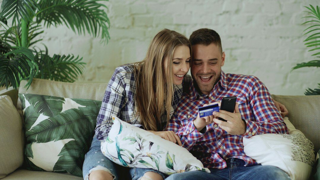 couple discussing finances on couch